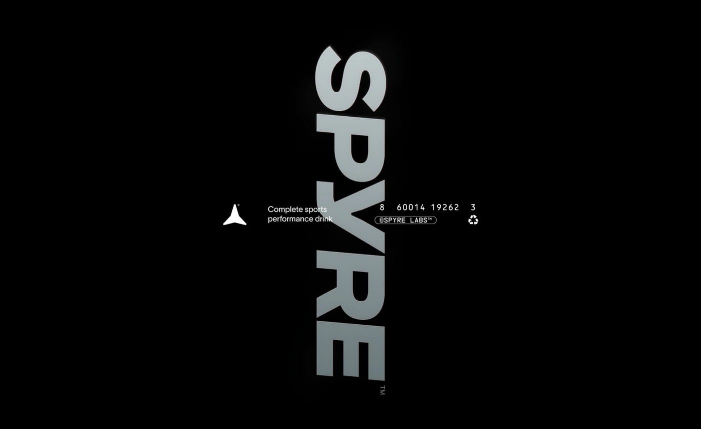 SPYRE sports drink packaging brand identity design — transparent bottle with near-colorless liquid by Hello Comrade