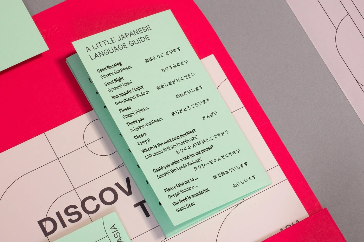 Image 6: detail of a Tokyo-themed design with red lines and clean white visual identity space