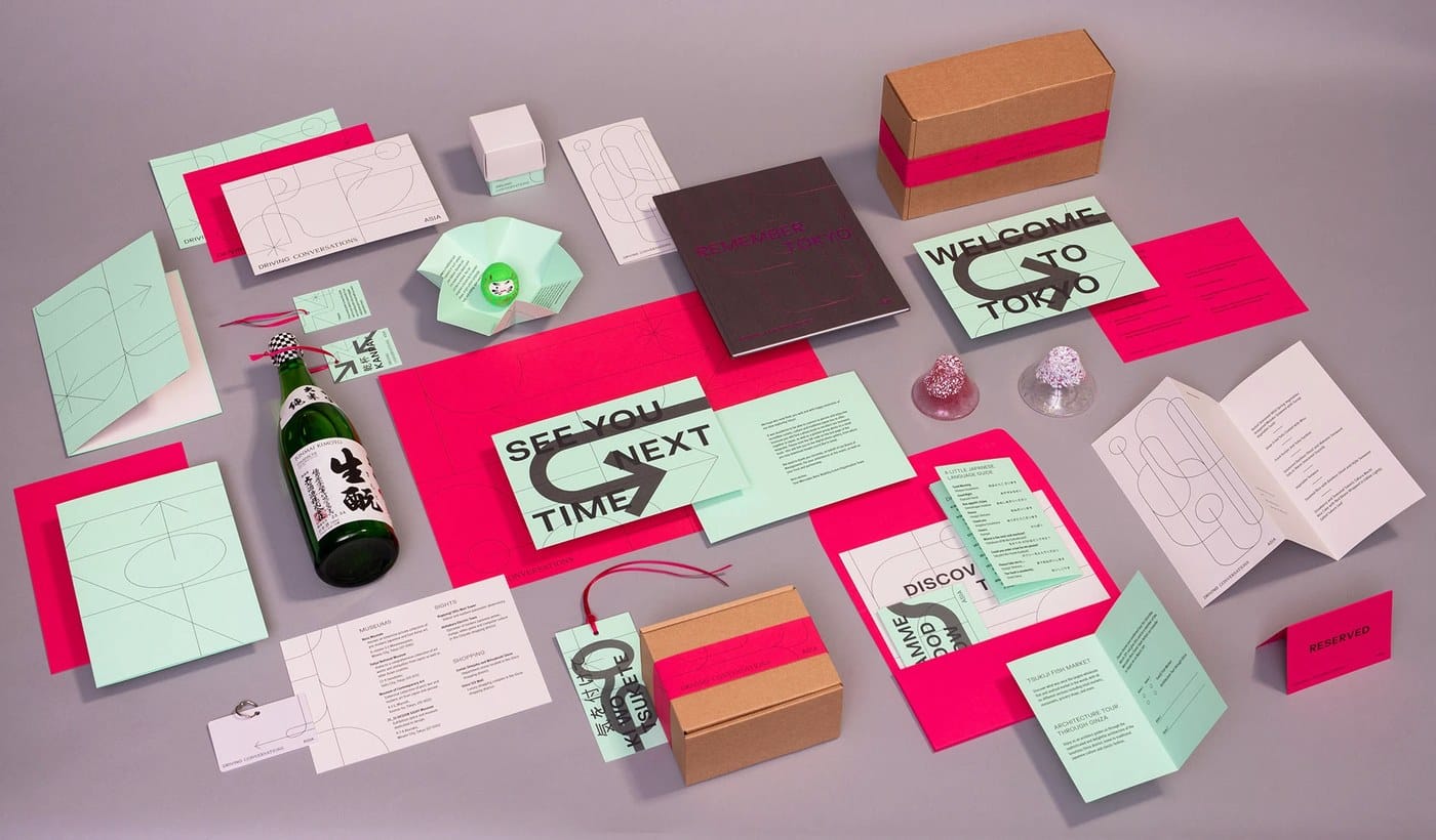 Image 3: close-up of a foldable booklet showing layered geometric visual identity patterns