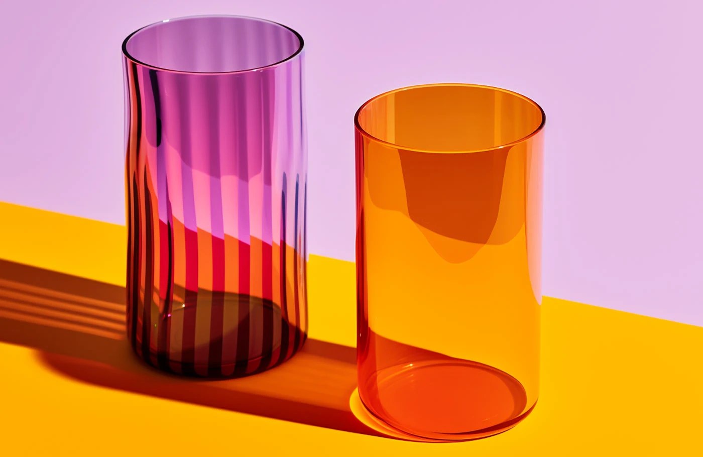 Image 2: Grandiose Collection glassware brand identity packaging — matte orange and olive cardboard boxes with black debossed logotype