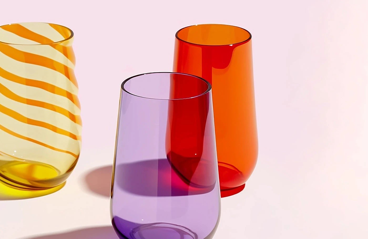 Image 3: Grandiose Collection glassware brand identity editorial spread — condensed serif headline on solid orange ground