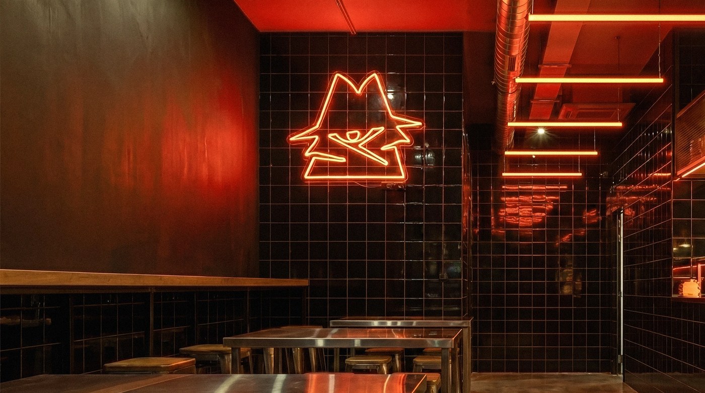 Image 5: Physical spatial mockups showcasing the AFTERBITE burger identity on boxes