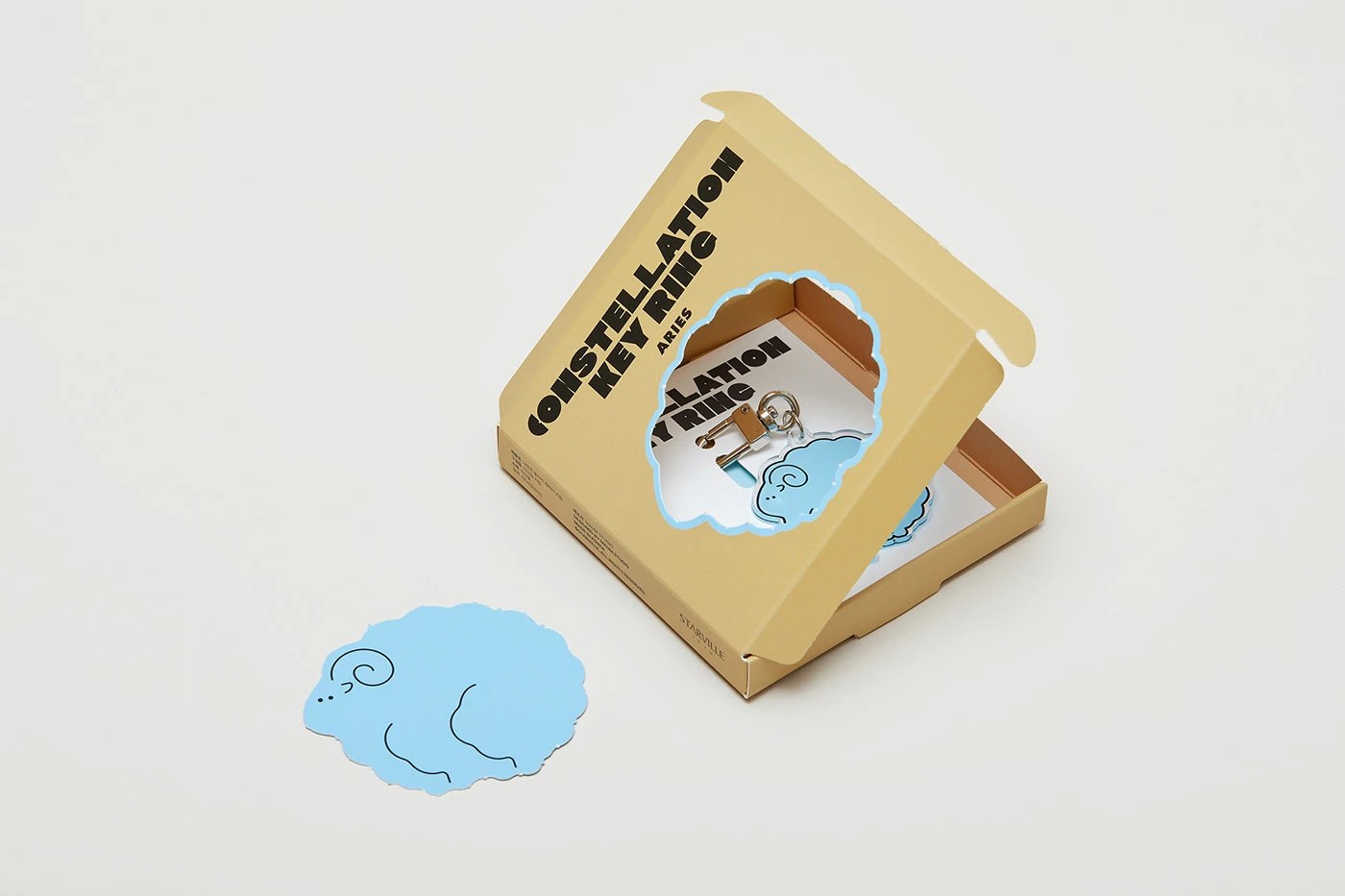 Image 5: Constellation packaging design — Aries kraft box with die-cut sticker and acrylic keyring