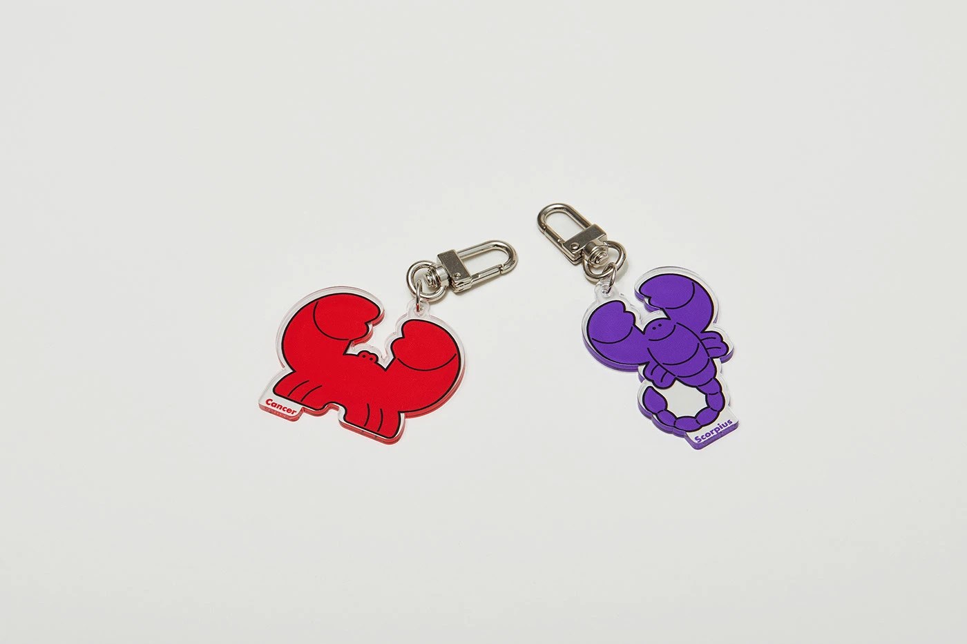 Image 6: Starville constellation packaging — Cancer and Scorpius acrylic keyrings on white
