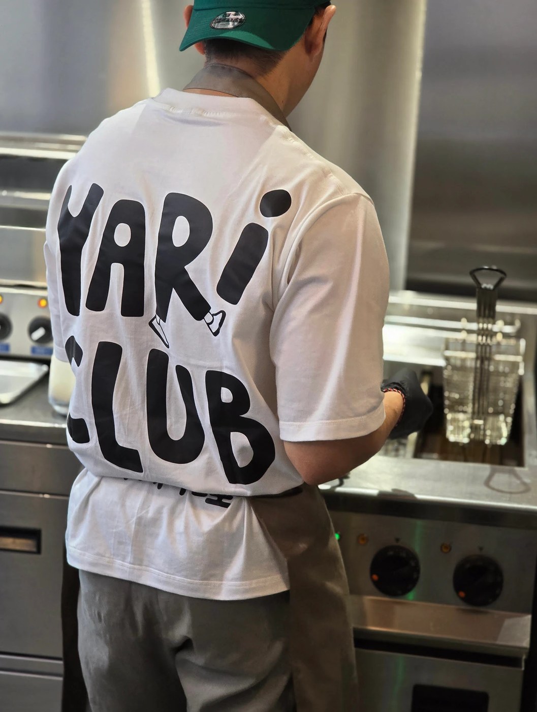 Image 5: YARI CLUB restaurant brand identity textured wooden sign board outside the diner.