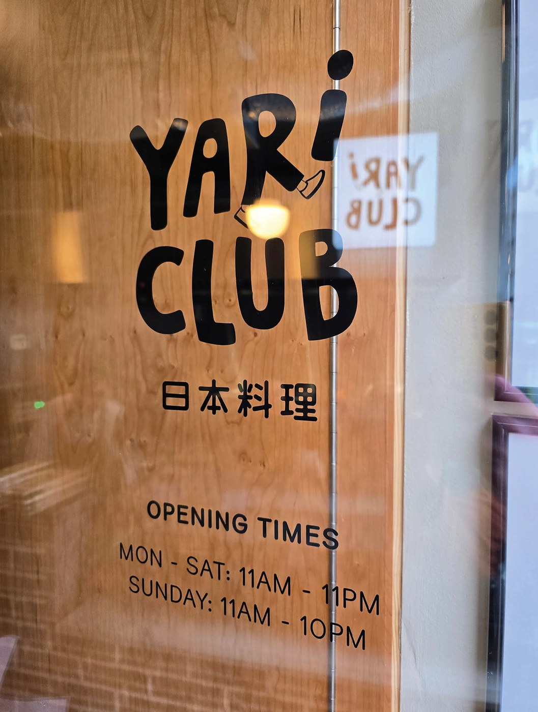Image 6: YARI CLUB restaurant brand identity concrete coasters with red logo debossing detail.