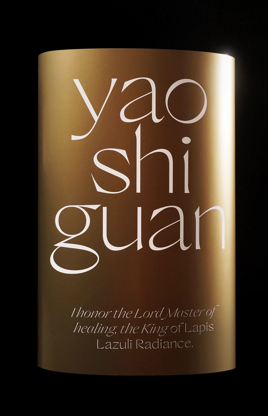 Image 4: sans serif typeface printed on cylinder gold object