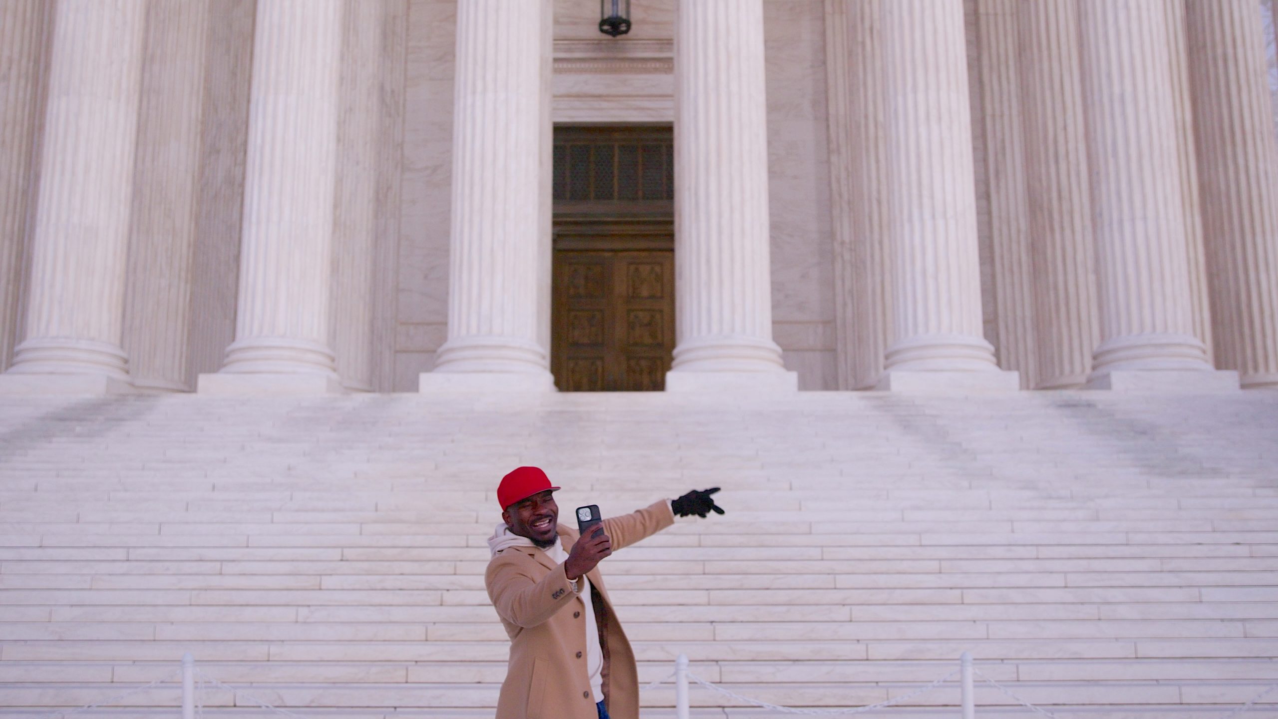 Image 5: Creator Topher Townsend filming on the steps of the US Supreme Court in TikTok Never Dies