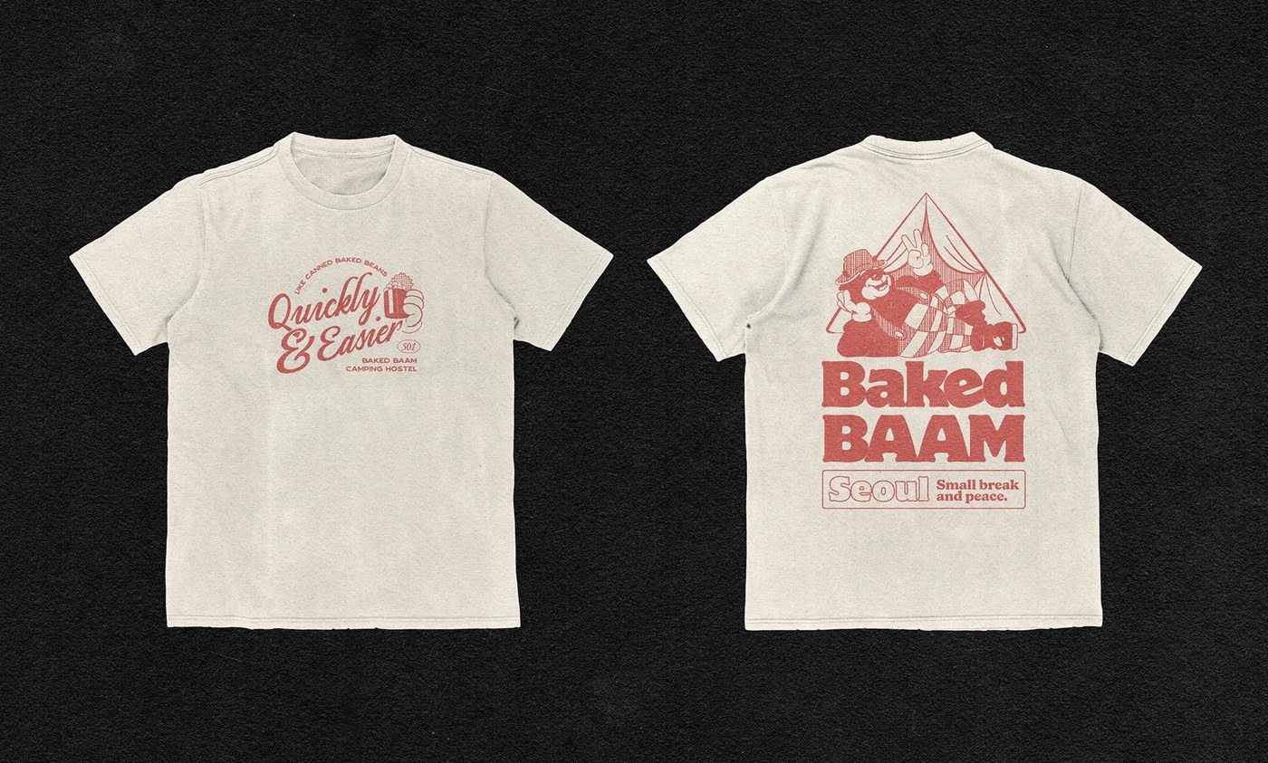 Image 8: Black graphic t-shirt featuring Baked Baam character graphics and brand messaging - bakery packaging design by Monga Design