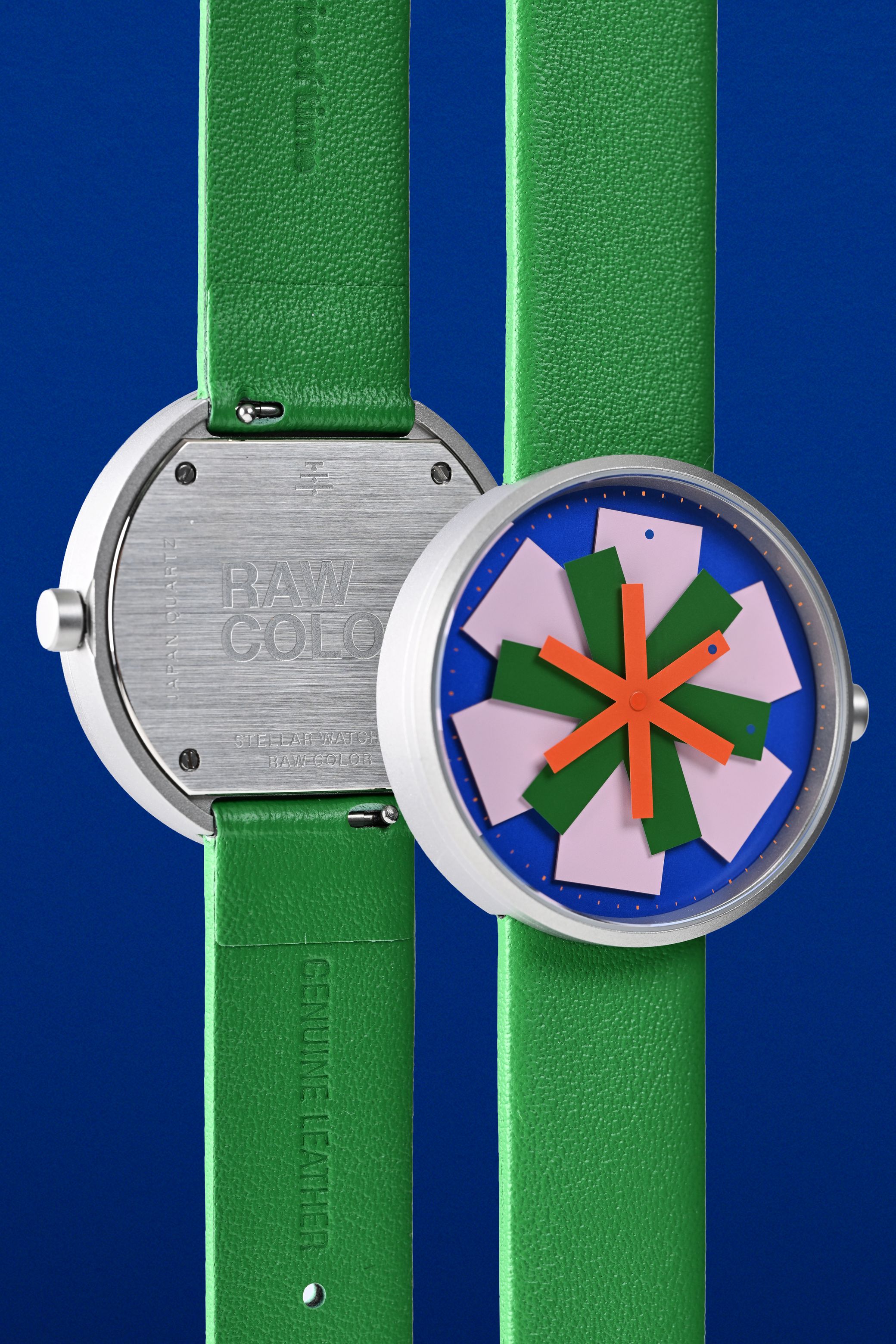 Image 3: Detailed macro photo showing the overlapping colorful hands of the stellar watch dial design