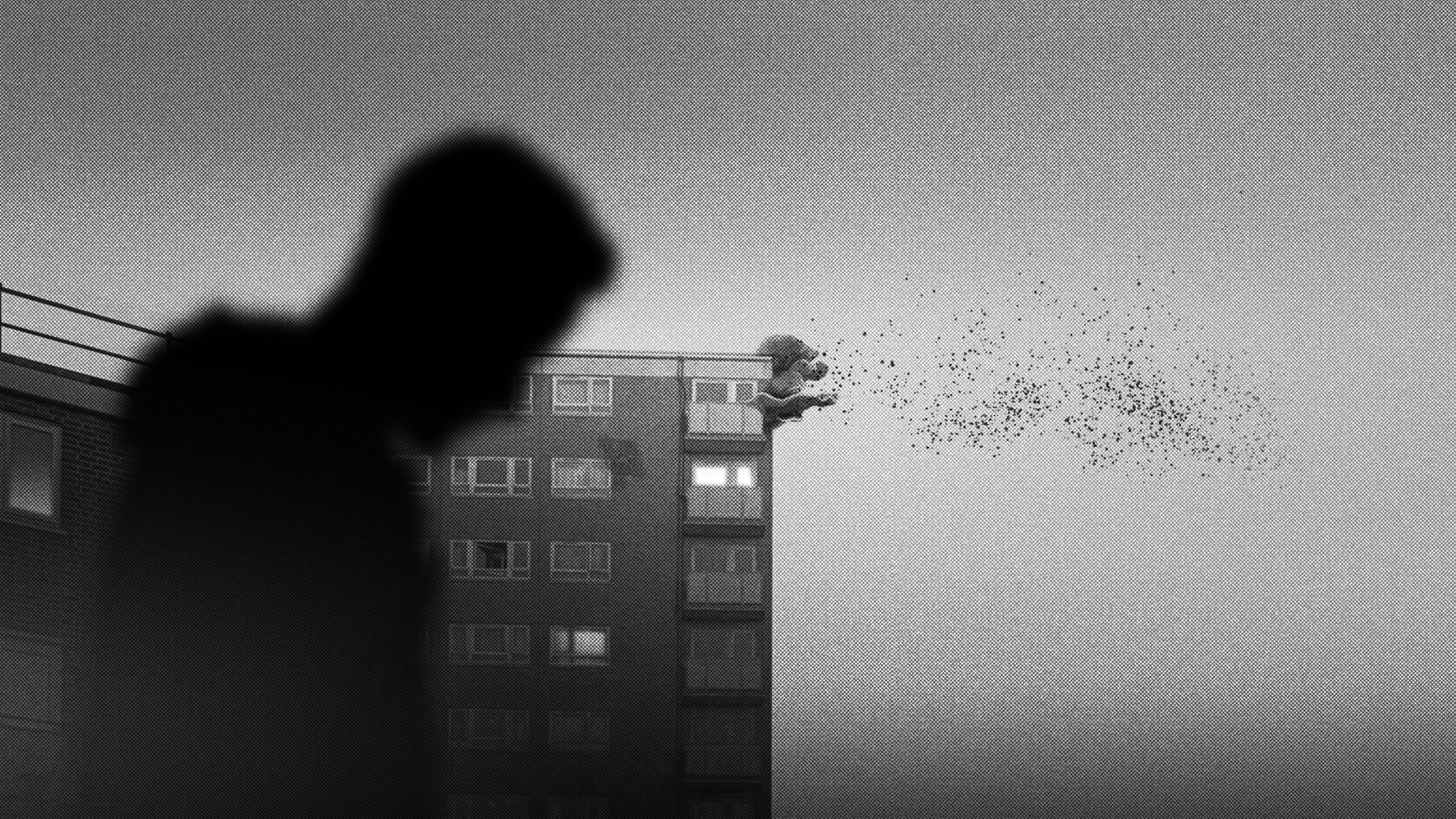 Image 7: Black and white images from a video game, a city cast in mist, building and people appear as silhouette