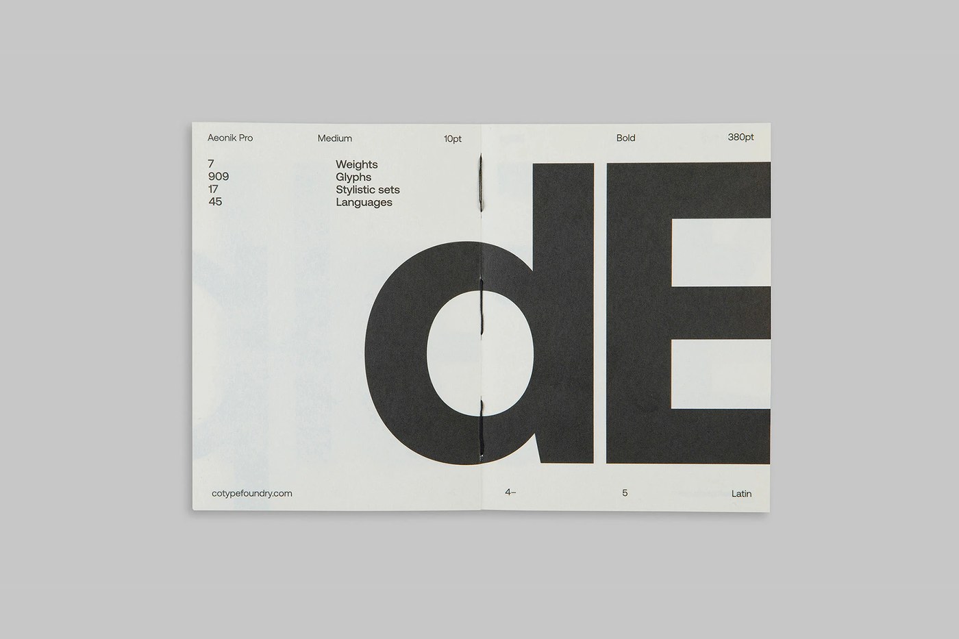 Image 8: Cover and back view of the aeonik pro sans-serif variable font specimen book set