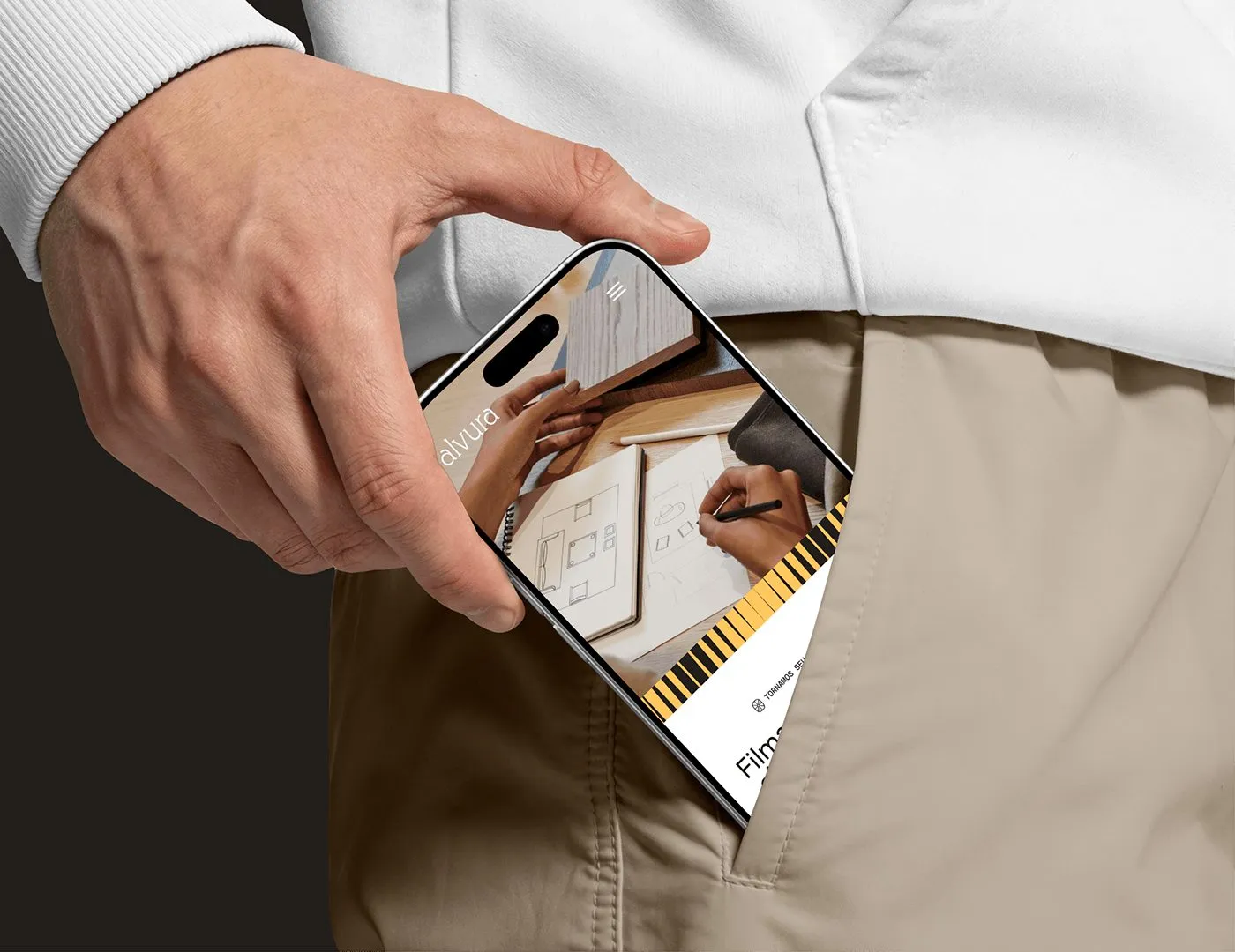 Image 4: Alvura Filmes branding mobile web interface displayed on phone in pocket