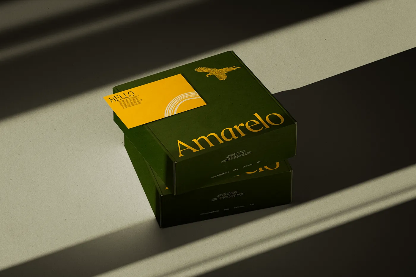 Image 2: Amarelo Beverages branding green packaging boxes and yellow note card