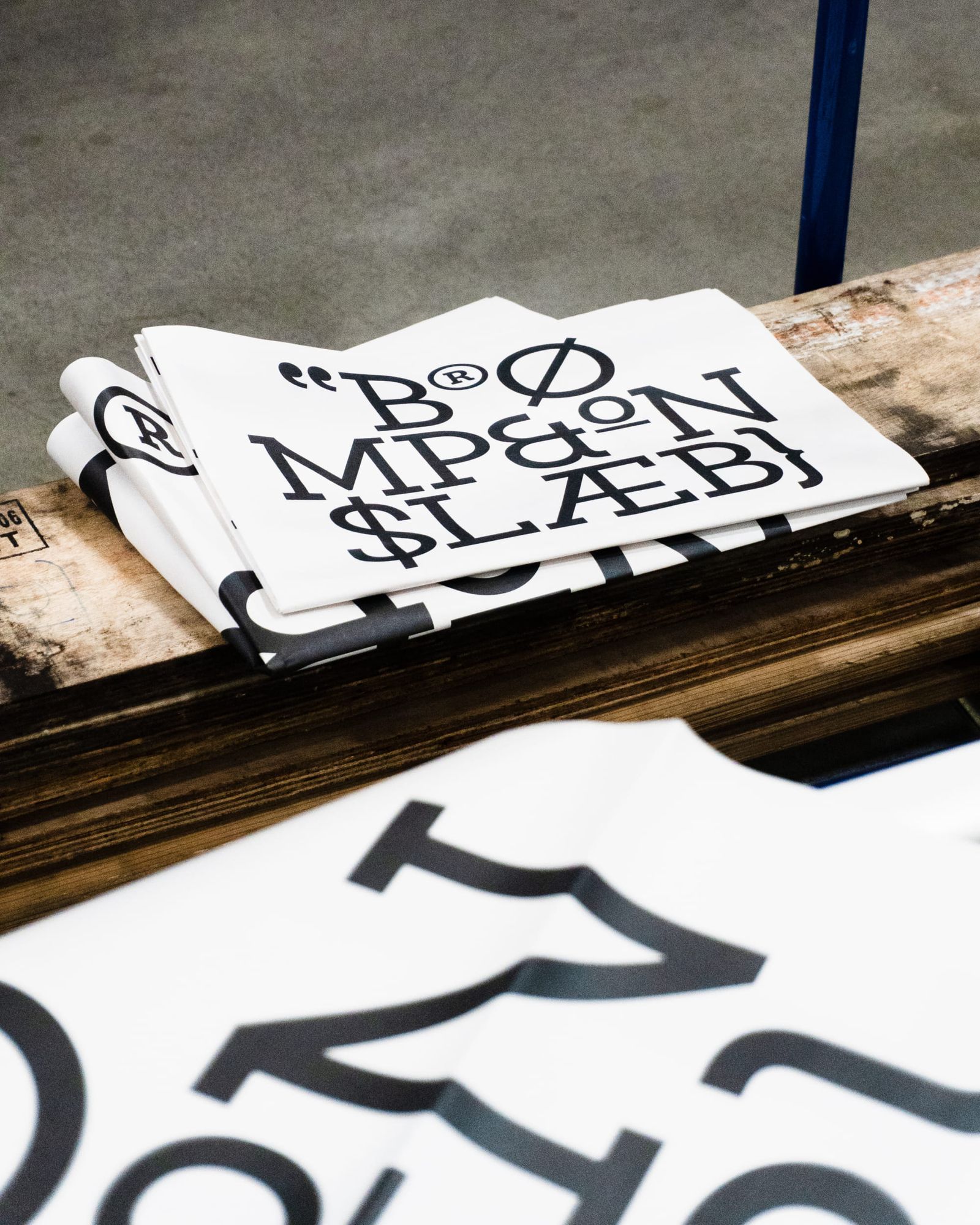 Image 8: Brompton global branding folded typography newspapers on wooden palette