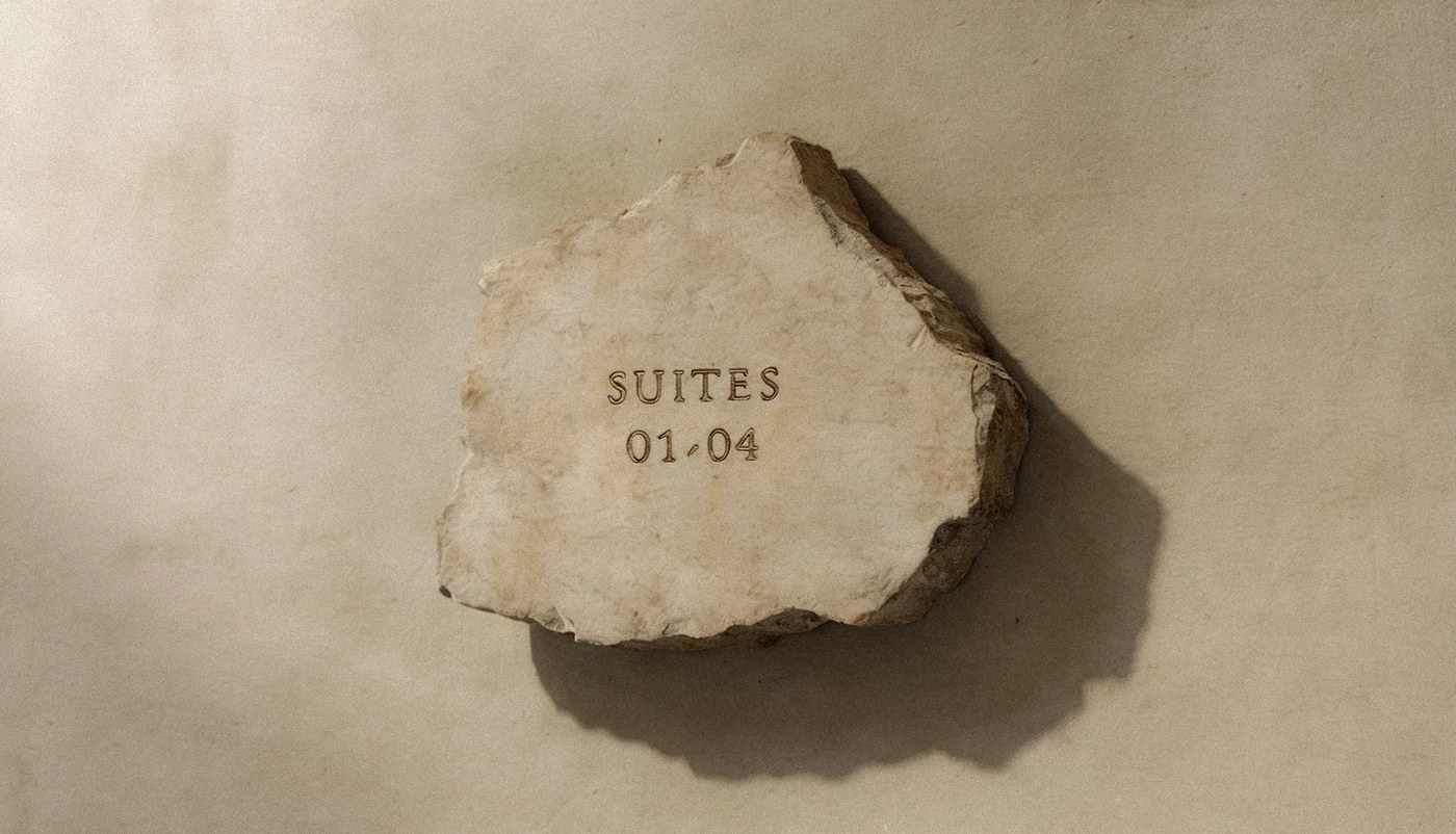 Image 5: hotel rigen fugitiva .co branding engraved stone sign detailing suite numbers